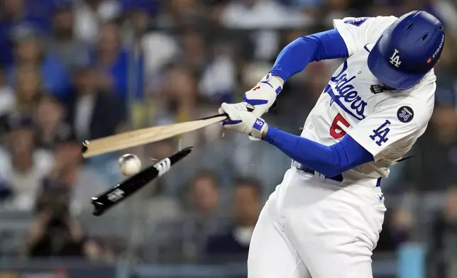 Los Angeles Dodgers' Freddie Freeman breaks his bat hitting a ground out against the New York Yankees during the fourth inning in Game 1 of the baseball World Series, Friday, Oct. 25, 2024, in Los Angeles. (AP Photo/Godofredo A. Vásquez)