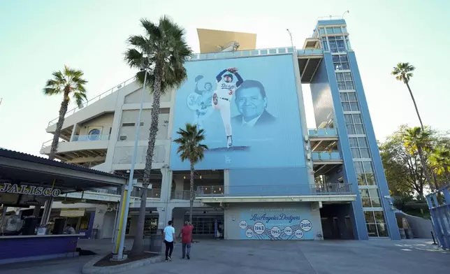 A mural is displayed of Los Angeles Dodgers legend Fernando Valenzuela at Dodger Stadium Thursday, Oct. 24, 2024, in Los Angeles. Valenzuela died Tuesday at age 63. The New York Yankees face the Dodgers in Game 1 of the baseball World Series Friday. (AP Photo/Ashley Landis)