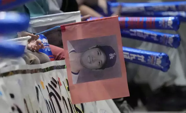 Children from Tokiwa Kindergarten where Shohei Ohtani graduated watch on a live stream of Game 3 of the baseball World Series between Los Angeles Dodgers and New York Yankees during a public viewing event in Oshu, northeast of Japan, the hometown of Shohei Ohtani of the Los Angeles Dodgers Tuesday, Oct. 29, 2024. (AP Photo/Eugene Hoshiko)