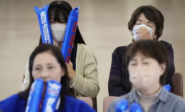 People react as they watch a live view of Game 4 of the baseball World Series between the Los Angeles Dodgers and the New York Yankees during a public viewing event in Oshu, northeastern Japan, the hometown of Shohei Ohtani of the Dodgers, Wednesday, Oct. 30, 2024. (AP Photo/Eugene Hoshiko)