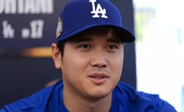 Los Angeles Dodgers' Shohei Ohtani speaks during media day for the baseball World Series against the New York Yankees, Thursday, Oct. 24, 2024, in Los Angeles. (AP Photo/Julio Cortez)