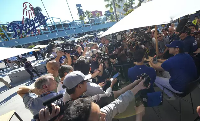 Los Angeles Dodgers' Shohei Ohtani speaks during media day for the baseball World Series against the New York Yankees, Thursday, Oct. 24, 2024, in Los Angeles. (AP Photo/Ashley Landis)