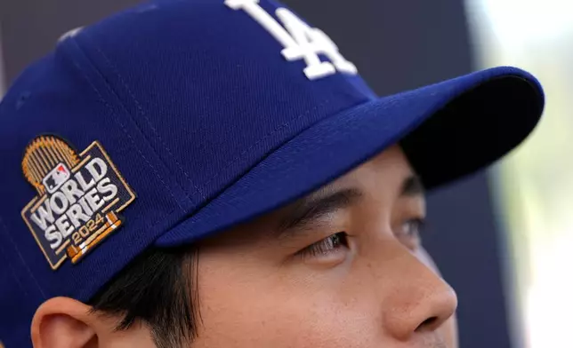 Los Angeles Dodgers' Shohei Ohtani speaks during media day for the baseball World Series against the New York Yankees, Thursday, Oct. 24, 2024, in Los Angeles. (AP Photo/Ashley Landis)