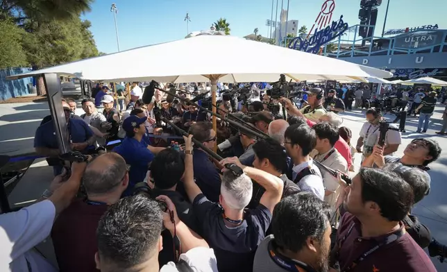 Los Angeles Dodgers' Shohei Ohtani speaks during media day for the baseball World Series against the New York Yankees, Thursday, Oct. 24, 2024, in Los Angeles. (AP Photo/Ashley Landis)