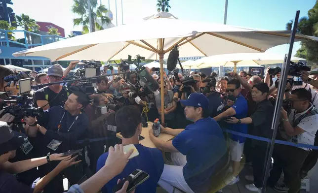 Los Angeles Dodgers' Shohei Ohtani speaks during media day for the baseball World Series against the New York Yankees, Thursday, Oct. 24, 2024, in Los Angeles. (AP Photo/Ashley Landis)