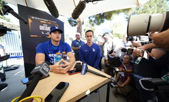 Los Angeles Dodgers' Shohei Ohtani speaks during media day for the baseball World Series against the New York Yankees, Thursday, Oct. 24, 2024, in Los Angeles. (AP Photo/Julio Cortez)