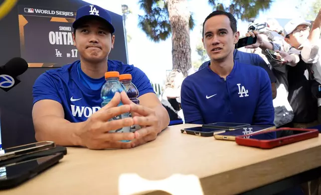 Los Angeles Dodgers' Shohei Ohtani speaks during media day for the baseball World Series against the New York Yankees, Thursday, Oct. 24, 2024, in Los Angeles. (AP Photo/Ashley Landis)