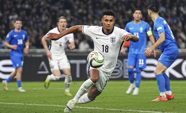 England's Ollie Watkins, right, controls the ball during the UEFA Nations League Group F soccer match between Greece and England at Olympic Stadium in Athens, Thursday, Nov. 14, 2024. (AP Photo/Petros Giannakouris)