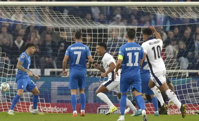 England's Ollie Watkins, center, celebrates after scoring the opening goal during the UEFA Nations League Group F soccer match between Greece and England at Olympic Stadium in Athens, Thursday, Nov. 14, 2024. (AP Photo/Petros Giannakouris)