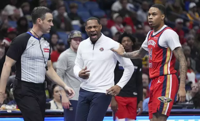 New Orleans Pelicans head coach Willie Green yells at an official, drawing a technical foul, in the first half of an Emirates NBA Cup basketball game against the Golden State Warriors in New Orleans, Friday, Nov. 22, 2024. (AP Photo/Gerald Herbert)