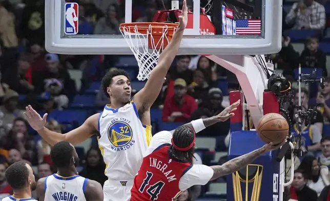 New Orleans Pelicans forward Brandon Ingram (14) shoots against Golden State Warriors forward Trayce Jackson-Davis (32) in the first half of an NBA basketball game in New Orleans, Friday, Nov. 22, 2024. (AP Photo/Gerald Herbert)