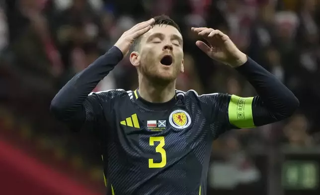 Scotland's Andy Robertson reacts during the UEFA Nations League soccer match between Poland and Scotland at Narodowy stadium in Warsaw, Poland, Monday, Nov. 18, 2024. (AP Photo/Czarek Sokolowski)