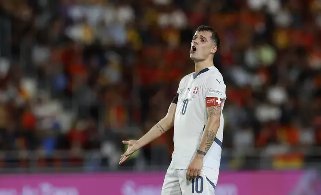 Switzerland's Granit Xhaka reacts during a Nations League soccer match between Spain and Switzerland, at the Heliodoro Rodríguez López stadium in Tenerife, Spain, Monday, Nov. 18, 2024. (AP Photo/Angel Fernandez)