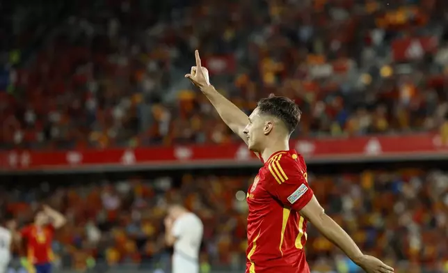 Spain's Zaragoza celebrates scoring his side's third goal during a Nations League soccer match between Spain and Switzerland, at the Heliodoro Rodríguez López stadium in Tenerife, Spain, Monday, Nov. 18, 2024. (AP Photo/Angel Fernandez)