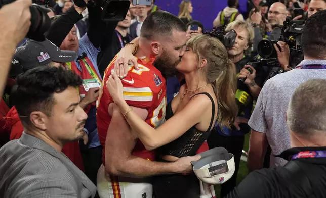 FILE - Kansas City Chiefs tight end Travis Kelce (87) kisses Taylor Swift after the Kansas City Chiefs defeated the San Francisco 49ers at the Super Bowl on Feb. 11, 2024, in Las Vegas. (AP Photo/John Locher, File)