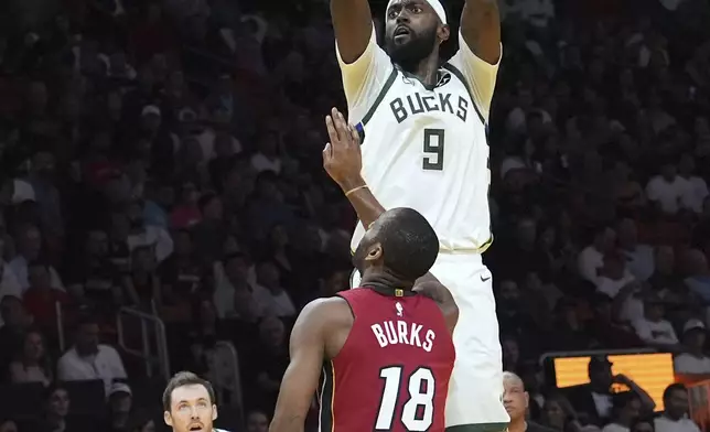 Milwaukee Bucks forward Bobby Portis (9) shoots over Miami Heat guard Alec Burks (18) during the first half of an Emirates NBA Cup basketball game, Tuesday, Nov. 26, 2024, in Miami. (AP Photo/Lynne Sladky)