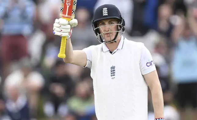 England's Harry Brook reacts after scoring a 150 runs during play on the third day of the first cricket test between England and New Zealand at Hagley Oval in Christchurch, New Zealand, Saturday, Nov. 30, 2024. (Andrew Cornaga/Photosport via AP)