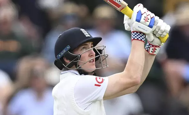 England's Harry Brook hits a six during play on the third day of the first cricket test between England and New Zealand at Hagley Oval in Christchurch, New Zealand, Saturday, Nov. 30, 2024. (Andrew Cornaga/Photosport via AP)