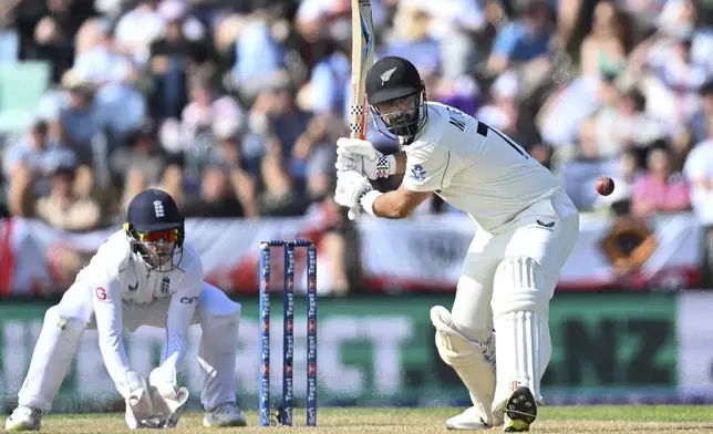 New Zealand's Daryl Mitchell bats during play on the third day of the first cricket test between England and New Zealand at Hagley Oval in Christchurch, New Zealand, Saturday, Nov. 30, 2024. (Andrew Cornaga/Photosport via AP)