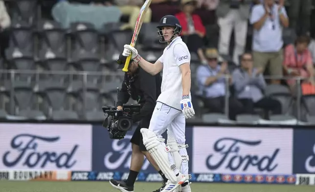 England's Harry Brook reacts as he leaves the field after he was dismissed for 171 runs during play on the third day of the first cricket test between England and New Zealand at Hagley Oval in Christchurch, New Zealand, Saturday, Nov. 30, 2024.(John Davidson/Photosport via AP)