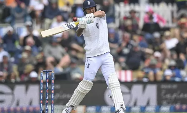 England's Brydon Carse bats during play on the third day of the first cricket test between England and New Zealand at Hagley Oval in Christchurch, New Zealand, Saturday, Nov. 30, 2024.(John Davidson/Photosport via AP)