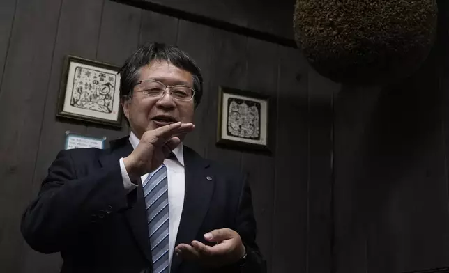 Hitoshi Utsunomiya, director of the Japan Sake and Shochu Makers Association, speaks during a media tour at Ozawa Sake Brewery in Ome, on the western outskirts of Tokyo, Japan, Wednesday, Nov. 13, 2024. (AP Photo/Hiro Komae)