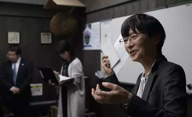 Nami Goto, managing director of Research and Development for the Brewing Society of Japan, speaks during a media tour at Ozawa Sake Brewery in Ome, on the western outskirts of Tokyo, Japan, Wednesday, Nov. 13, 2024. (AP Photo/Hiro Komae)