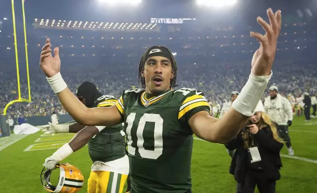 Green Bay Packers quarterback Jordan Love (10) celebrates a win after an NFL football game against the San Francisco 49ers on Sunday, Nov. 24, 2024 in Green Bay, Wis. (AP Photo/Morry Gash)