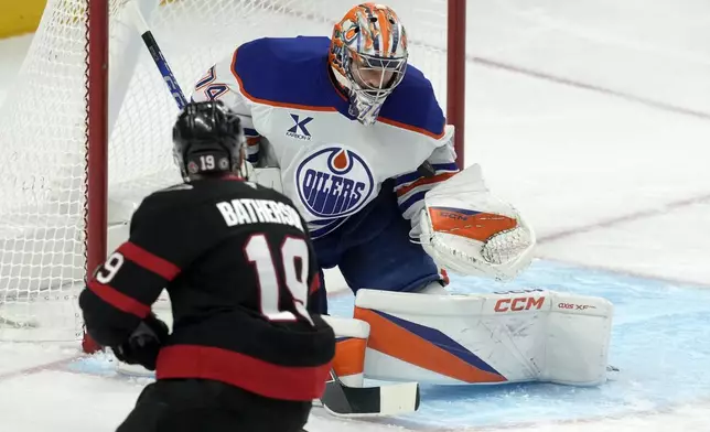 Edmonton Oilers goaltender Stuart Skinner makes a save on Ottawa Senators right wing Drake Batherson (19) during the first period of an NHL hockey game, Tuesday, Nov. 19, 2024 in Ottawa, Ontario. (Adrian Wyld/The Canadian Press via AP)