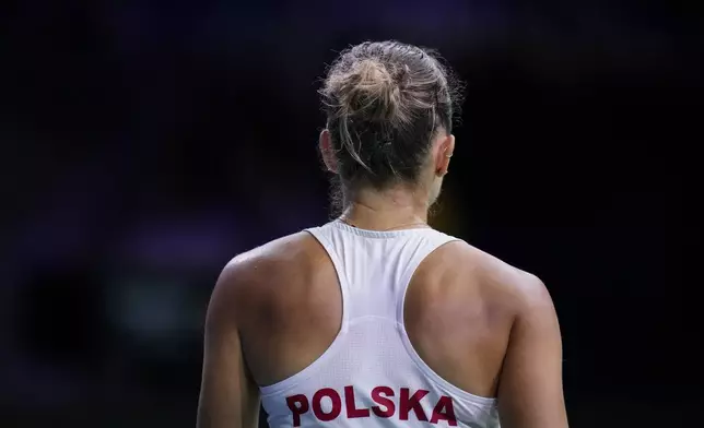 Poland's Magda Linette competes against Spain's Sara Sorriber Tormo during the Billie Jean King Cup Finals, at the Martin Carpena Sports Hall, in Malaga, southern Spain, on Friday, Nov. 15, 2024. (AP Photo/Manu Fernandez)