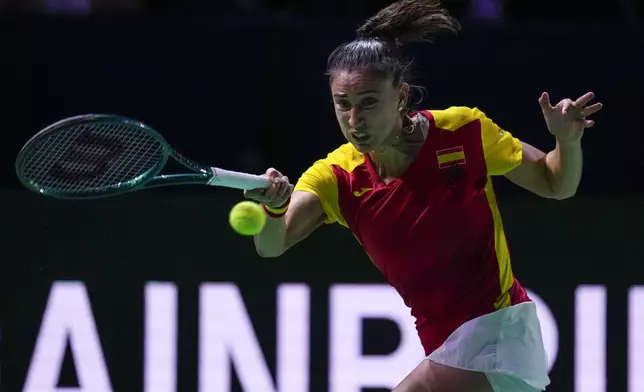 Spain's Sara Sorriber Tormo returns the ball against Poland's Magda Linette during the Billie Jean King Cup Finals, at the Martin Carpena Sports Hall, in Malaga, southern Spain, on Friday, Nov. 15, 2024. (AP Photo/Manu Fernandez)