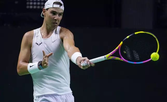 Spain's tennis player Rafael Nadal takes part in a training session at the Martin Carpena Sports Hall, in Malaga, southern Spain, on Friday, Nov. 15, 2024. (AP Photo/Manu Fernandez)