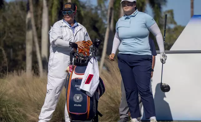 Angel Yin, right, looks down the fairway on the ninth hole during the final round of the LPGA CME Group Tour Championship golf tournament Sunday, Nov. 24, 2024, in Naples, Fla. (AP Photo/Chris Tilley)