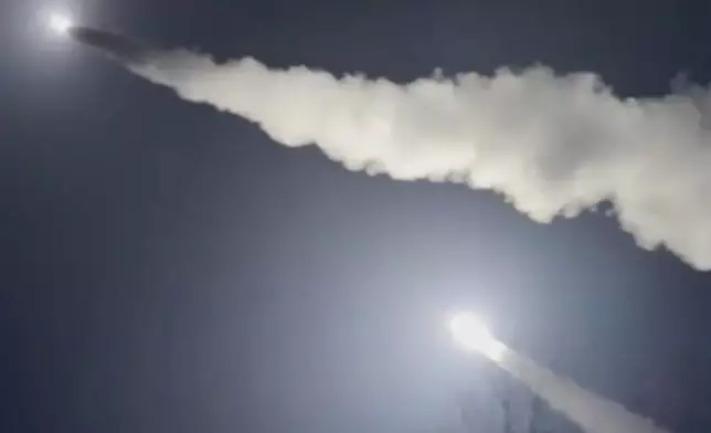 This image was made from a video posted by a Telegram channel affiliated with the Ukrainian military on Tuesday, Nov. 19, 2024. The channel says it shows U.S.-supplied ATACMS missiles being fired from an undisclosed location in Ukraine. The Associated Press cannot independently verify the date and location the video was filmed. (Lachen Pyshe Telegram via AP)