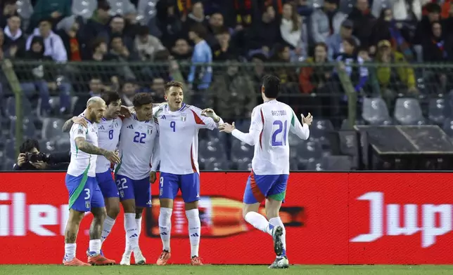 Italy celebrate after Italy's Sandro Tonali, second left, scored the opening goal during the UEFA Nations League, group A2, soccer match between Belgium and Italy at the King Baudouin Stadium in Brussels, Belgium, Thursday, Nov. 14, 2024. (AP Photo/Omar Havana)