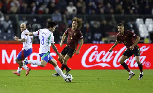 Italy's Sandro Tonali, second left, is challenged by Belgium's Timothy Castagne, right, during the UEFA Nations League, group A2, soccer match between Belgium and Italy at the King Baudouin Stadium in Brussels, Belgium, Thursday, Nov. 14, 2024. (AP Photo/Omar Havana)