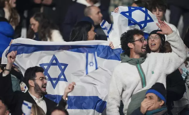 Israel supporters react during the UEFA Nations League soccer match between France and Israel at the Sea de de France stadium in Saint-Denis, outside Paris, Thursday Nov. 14, 2024. (AP Photo/Michel Euler)