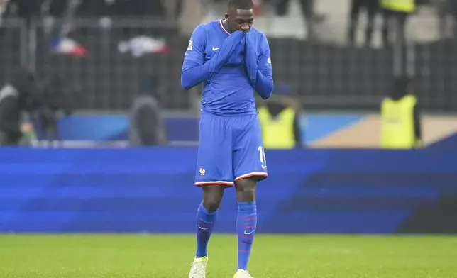 France's Ibrahim Konate reacts following the UEFA Nations League soccer match between France and Israel at the Sea de de France stadium in Saint-Denis, outside Paris, Thursday Nov. 14, 2024. (AP Photo/Michel Euler)