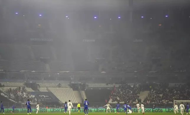 Players challenge for the ball during the UEFA Nations League soccer match between France and Israel at the Stade de France stadium in Saint-Denis, outside Paris, Thursday Nov. 14, 2024. (AP Photo/Thibault Camus)