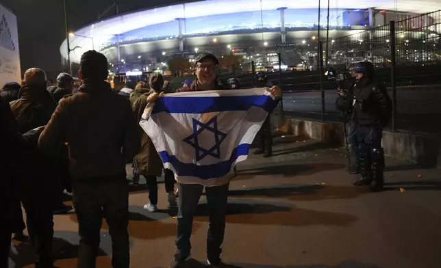 Israeli supporters arrive at the Stade de France stadium ahead of the Nations League soccer match France against Israel , Thursday, Nov. 14, 2024 in Saint-Denis, outside Paris. (AP Photo/Aurelien Morissard)