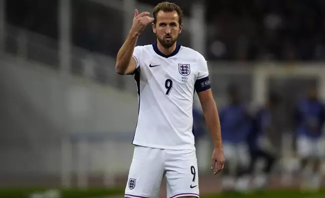 England's Harry Kane gestures during the UEFA Nations League Group F soccer match between Greece and England at Olympic Stadium in Athens, Thursday, Nov. 14, 2024. (AP Photo/Thanassis Stavrakis)