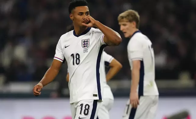 England's Ollie Watkins celebrates after scoring his sides first goal during the UEFA Nations League Group F soccer match between Greece and England at Olympic Stadium in Athens, Thursday, Nov. 14, 2024. (AP Photo/Thanassis Stavrakis)