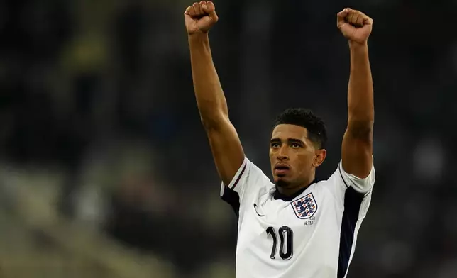 England's Jude Bellingham celebrates after the UEFA Nations League Group F soccer match between Greece and England at Olympic Stadium in Athens, Thursday, Nov. 14, 2024. (AP Photo/Thanassis Stavrakis)