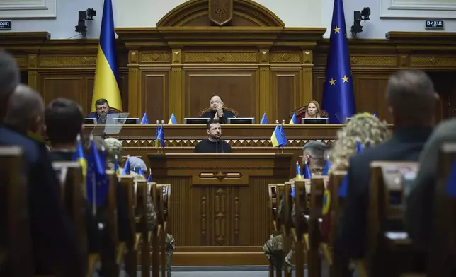 In this photo provided by the Press Service Of The President Of Ukraine on Nov. 19, 2024, Ukraine's President Volodymyr Zelenskyy speaks to parliamentarians at Verkhovna Rada in Kyiv, Ukraine. (Press Service Of The President Of Ukraine via AP)