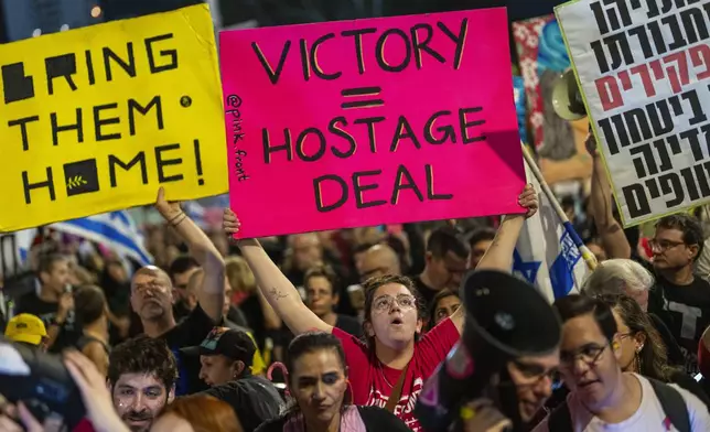 People shout slogans during a protest against Prime Minister Benjamin Netanyahu's government and call for the release of hostages held in the Gaza Strip by the Hamas militant group, in Tel Aviv, Israel, Saturday, Nov. 16, 2024. (AP Photo/Francisco Seco)