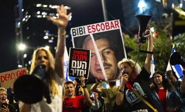 People shout slogans during a protest against Prime Minister Benjamin Netanyahu's government and call for the release of hostages held in the Gaza Strip by the Hamas militant group, in Tel Aviv, Israel, Saturday, Nov. 16, 2024. (AP Photo/Francisco Seco)