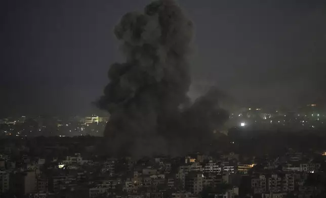 Smoke rises after an Israeli airstrike on Dahiyeh, in the southern suburb of Beirut, Lebanon, Saturday, Nov. 16, 2024. (AP Photo/Bilal Hussein)