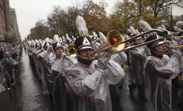 The University of Massachusetts Minutemen marching band plays as it makes its way down Central Park West while participating in the Macy's Thanksgiving Day Parade, Thursday, Nov. 28, 2024, in New York. (AP Photo/Yuki Iwamura)