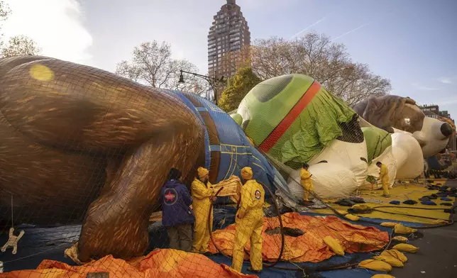 People inflate floats in preparation for the Macy's Thanksgiving Day Parade, Wednesday, Nov. 27, 2024, in New York. (AP Photo/Yuki Iwamura)