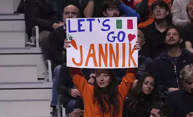 A supporter of Italy's Jannik Sinner holds up a sign during the singles tennis match of the ATP World Tour Finals between Australia's Alex de Minaur and Italy's Jannik Sinner, at the Inalpi Arena, in Turin, Italy, Sunday, Nov. 10, 2024. (AP Photo/Antonio Calanni)